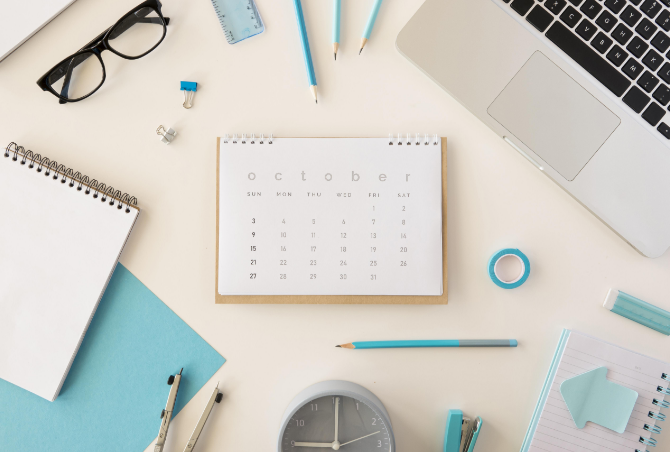 flat-lay-desk-calendar-with-blue-office-accessories