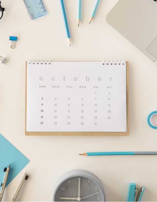 flat-lay-desk-calendar-with-blue-office-accessories