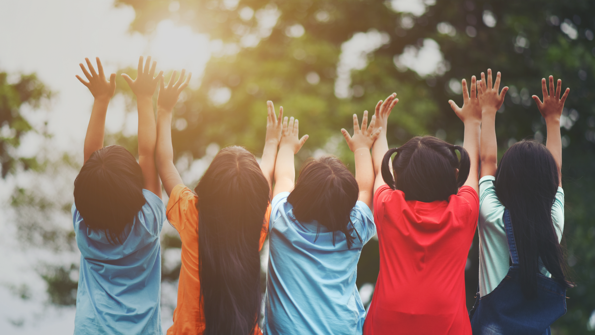 group-of-kids-friends-arm-around-sitting-together